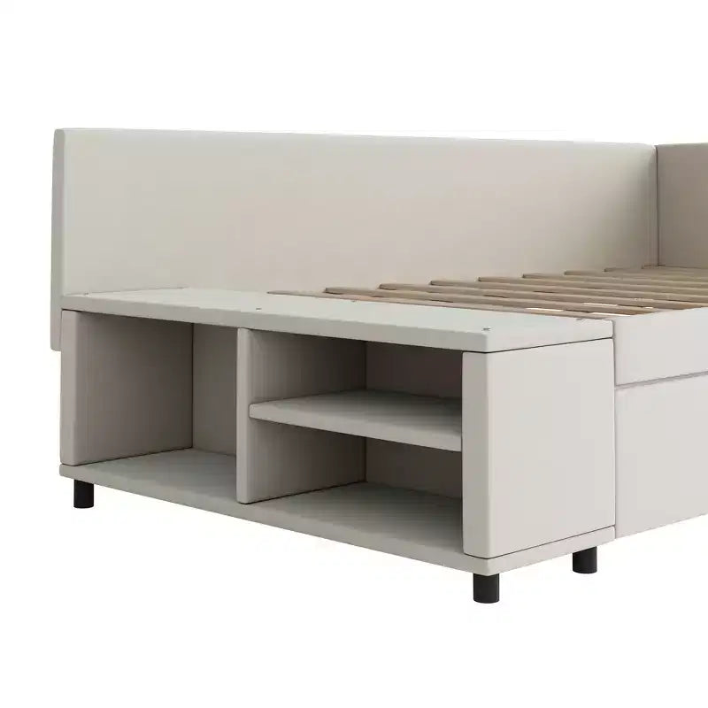 Lit plateforme Whisen une place en L avec rangement enveloppant et tiroirs, construction robuste et durable.