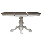Table à dîner ronde sur pied Magnolia Manor avec rallonges escamotables - 2 finitions